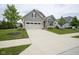Charming home with a well-manicured lawn, inviting two-car garage, and classic exterior at 16209 Natures Way, Westfield, IN 46074