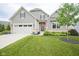 Charming home features a manicured lawn, two-car garage, and beautiful landscaping at 16209 Natures Way, Westfield, IN 46074