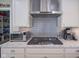 Kitchen boasts stainless steel appliances, gas cooktop, and granite countertops at 16209 Natures Way, Westfield, IN 46074