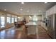 Open kitchen and dining area with stainless steel appliances and hardwood floors at 16209 Natures Way, Westfield, IN 46074