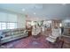 Open concept living room with views of the kitchen, wood floors, and comfortable seating at 16209 Natures Way, Westfield, IN 46074