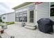 Outdoor patio area with modern gas grill and peaceful views of surrounding yards at 16209 Natures Way, Westfield, IN 46074