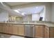 Wet bar with granite countertops, stainless steel appliances and wood cabinets in finished basement at 16209 Natures Way, Westfield, IN 46074