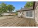 Outdoor deck area featuring access to the home and a detached garage at 1631 S Post Rd, Indianapolis, IN 46239