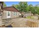 Outdoor deck with a stone fireplace, perfect for entertaining guests at 1631 S Post Rd, Indianapolis, IN 46239