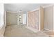 Open bedroom with tiled floor shower and access to another room at 1631 S Post Rd, Indianapolis, IN 46239
