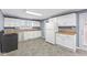 Spacious kitchen features stainless steel appliances, tile floors, and white cabinets at 1631 S Post Rd, Indianapolis, IN 46239