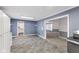 Open kitchen with tiled floors and neutral paint throughout at 1631 S Post Rd, Indianapolis, IN 46239