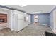 The kitchen features tiled floors, a window, and white cabinets at 1631 S Post Rd, Indianapolis, IN 46239