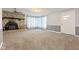 Inviting living room with a stone fireplace and ample natural light at 1631 S Post Rd, Indianapolis, IN 46239