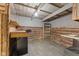 The workshop has vinyl flooring and natural wood walls and cabinets at 1631 S Post Rd, Indianapolis, IN 46239