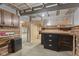 Wood-paneled workshop interior features custom cabinets and counters at 1631 S Post Rd, Indianapolis, IN 46239