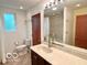 Bright bathroom with a large mirror and updated vanity at 1802 Laurel Dr, Columbus, IN 47203