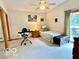 Well-lit bedroom with view to the backyard and deck at 1802 Laurel Dr, Columbus, IN 47203
