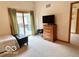Bright bedroom with an adjacent full bathroom at 1802 Laurel Dr, Columbus, IN 47203