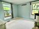 Serene bedroom with windows and minimalist decor at 1802 Laurel Dr, Columbus, IN 47203