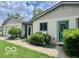 Charming single-story home with a well-maintained lawn, lush shrubs, and an inviting entrance at 1802 Laurel Dr, Columbus, IN 47203