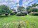Charming single-story home with lush green lawn at 1802 Laurel Dr, Columbus, IN 47203