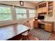 Cozy office with built-in shelving, a desk, and natural light from multiple windows at 1802 Laurel Dr, Columbus, IN 47203
