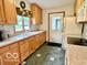 Traditional kitchen featuring warm wood cabinets and updated backsplash at 1802 Laurel Dr, Columbus, IN 47203