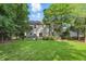 Expansive backyard featuring lush green grass and mature trees at 18112 Kinder Oak Dr, Noblesville, IN 46062