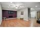 Spacious basement featuring a large wall-mounted TV, wood laminate floors, and neutral walls at 18112 Kinder Oak Dr, Noblesville, IN 46062