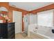 Bathroom with separate shower and tub, round mirror, and tile floor at 18112 Kinder Oak Dr, Noblesville, IN 46062