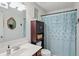 Compact bathroom with patterned shower curtain and sink at 18112 Kinder Oak Dr, Noblesville, IN 46062