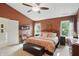 Spacious bedroom features neutral carpet, ceiling fan, and a comfortable seating area at 18112 Kinder Oak Dr, Noblesville, IN 46062