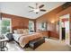 Spacious bedroom features neutral carpet, ceiling fan, and a comfortable seating area at 18112 Kinder Oak Dr, Noblesville, IN 46062