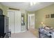 Neutral Bedroom with closet, ceiling fan, olive walls and a view to the hallway at 18112 Kinder Oak Dr, Noblesville, IN 46062