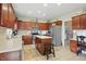 Well-lit kitchen featuring wooden cabinets, stainless steel appliances, and a center island at 18112 Kinder Oak Dr, Noblesville, IN 46062