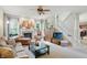 Inviting living room with a fireplace, neutral tones, and stairs leading to the upper level at 18112 Kinder Oak Dr, Noblesville, IN 46062