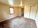 A bedroom featuring carpet floors and double closets at 1908 S Biltmore Ave, Muncie, IN 47302
