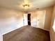 A bedroom with carpet floors, neutral walls, and white trim at 1908 S Biltmore Ave, Muncie, IN 47302