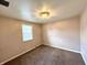 A bedroom with carpet floors and neutral walls at 1908 S Biltmore Ave, Muncie, IN 47302