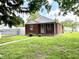 Inviting brick home with a green lawn and a charming pathway to the front door at 1908 S Biltmore Ave, Muncie, IN 47302