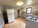 A kitchen featuring neutral color cabinets, wood countertops, and white appliances at 1908 S Biltmore Ave, Muncie, IN 47302