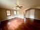 Open living room with hardwood floors and a ceiling fan for added comfort at 1908 S Biltmore Ave, Muncie, IN 47302