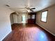 Spacious living room with hardwood floors, ceiling fan, and natural light at 1908 S Biltmore Ave, Muncie, IN 47302