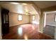 Large living room with hardwood floors, natural light, and an open layout at 1908 S Biltmore Ave, Muncie, IN 47302