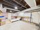 Unfinished basement featuring concrete floor, exposed ceiling, and potential for customization at 1910 W 10Th St, Anderson, IN 46016
