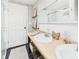 Bright bathroom featuring double sinks, wood-look countertop and charming decorative accents at 1910 W 10Th St, Anderson, IN 46016