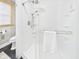 Modern bathroom featuring a glass-enclosed shower with white subway tile and updated fixtures at 1910 W 10Th St, Anderson, IN 46016