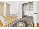 Cozy bedroom featuring a stylish area rug and closet with built-in shelving and drawers at 1910 W 10Th St, Anderson, IN 46016