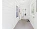 Cozy entryway with coat hooks, natural light, and neutral paint at 1910 W 10Th St, Anderson, IN 46016