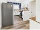 Well-lit kitchen featuring white cabinets, stainless steel appliances, and wood countertops at 1910 W 10Th St, Anderson, IN 46016