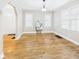 Bright living room with hardwood floors and two large windows at 1910 W 10Th St, Anderson, IN 46016
