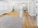 Spacious living room with hardwood floors, white shiplap walls, and an open floor plan at 1910 W 10Th St, Anderson, IN 46016