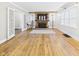 Bright living room with hardwood floors, fireplace, and natural light from large windows at 1910 W 10Th St, Anderson, IN 46016